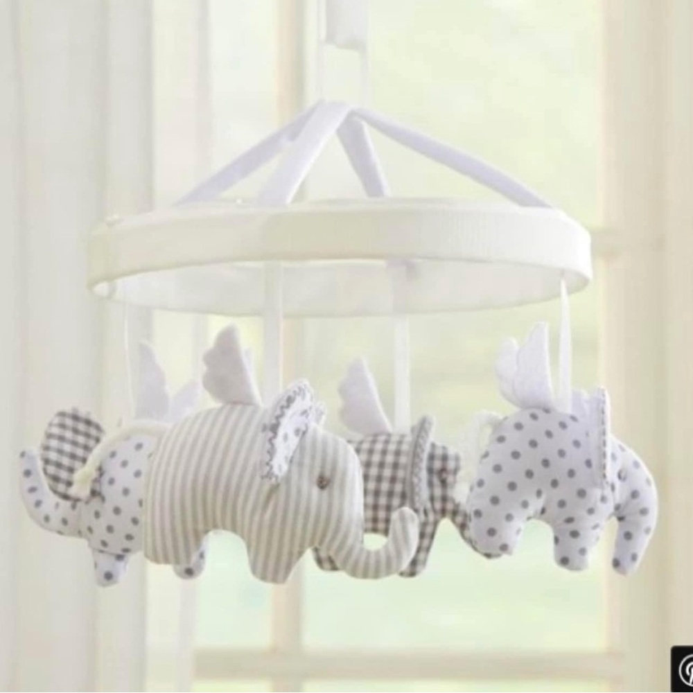 Pottery barn elephant mobile with white arm included to attach to crib